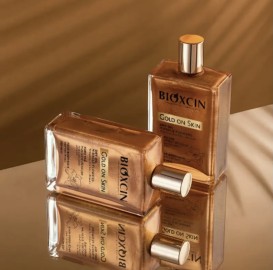 روغن مرطوب کننده و شاین صورت و بدن و مو بیوکسین Bioxin مدل Gold On Skin